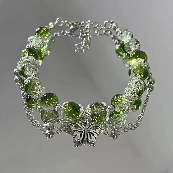 Retro náramek stříbrný motýl zelené korálky